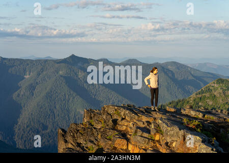 Hiker getting ready for a sunrise yoga session at Mt Rainier in Wash. Stock Photo