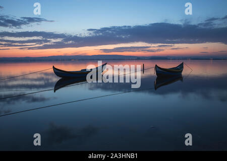 two wooden boats at sunrise Stock Photo