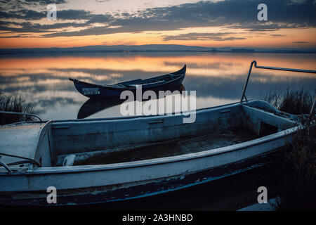 wooden boats at sunrise Stock Photo