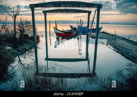 wooden traditional portuguese boats at sunrise Stock Photo