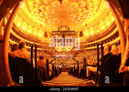 Stephen Barlow conducts the Bournemouth Symphony Orchestra and Chorus on stage at Classic FM Live at London's Royal Albert Hall. Stock Photo