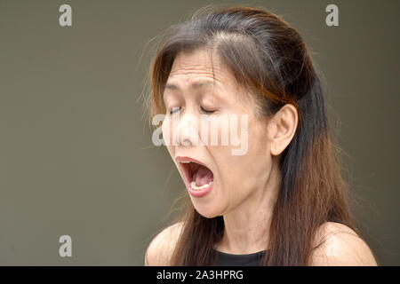 An Old Asian Grandma Yelling Stock Photo