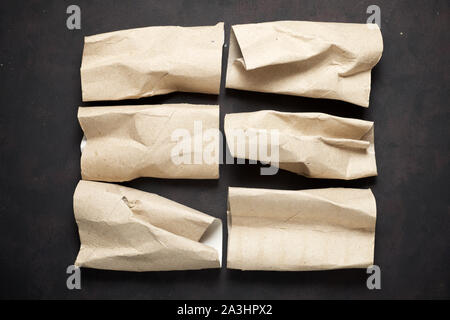 Empty toilet paper rolls on a black table Stock Photo