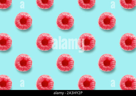 Vivid fruit pattern of fresh raspberries on colourful background Stock Photo
