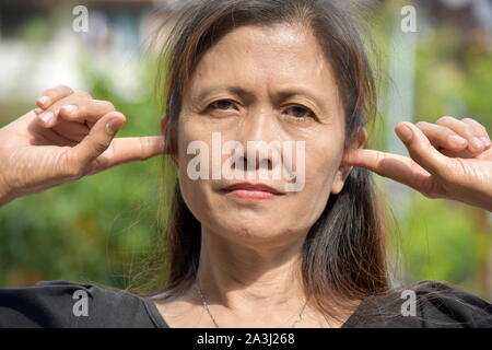 Older Filipina Female Senior And Silence Stock Photo