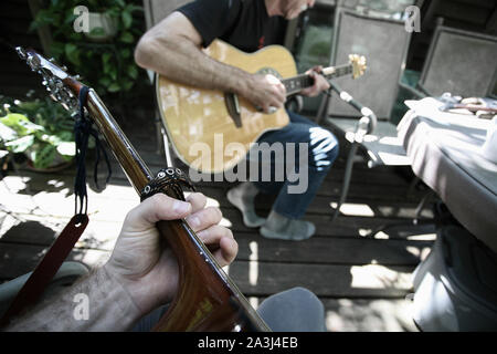 First person perspective playing guitar with another person. Stock Photo