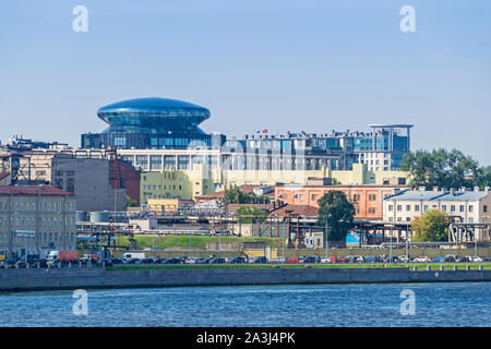 Saint Petersburg, Russia -  July 26, 2019: Sinopskaya Embankment of the River Neva with rush-hour traffic and a prominent rooftop of the Committee for Stock Photo