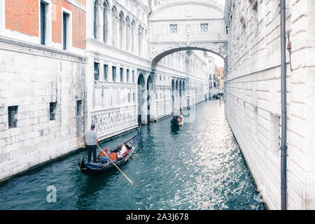Venice, Italy - August 7, 2014: gondolas and boats on venetian canal Stock Photo