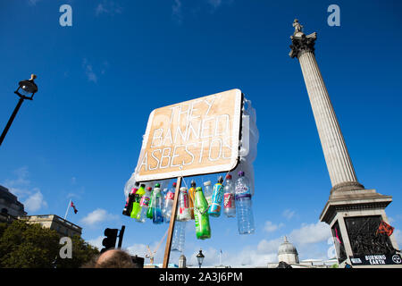 London, UK. 08th Oct, 2019. Placard saying, they banned asbestos, during the environmental protest by Extinction Rebellion activist group.Extinction Rebellion is an international movement that uses non-violent civil disobedience in an attempt to halt mass extinction and minimise the risk of social collapse. The group has blocked a number of key junctions in central London. Credit: SOPA Images Limited/Alamy Live News Stock Photo