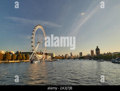 Evening view of the London Eye looking West from the Golden Jubilee bridge. Stock Photo