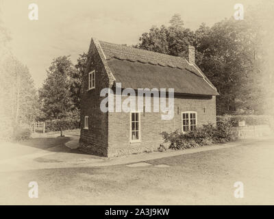 The charming Victorian era Marshmans Toad Hole Cottage near Ludham on the Norfolk Broads Stock Photo