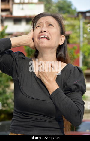 A Stressed Filipina Gramma Stock Photo - Alamy