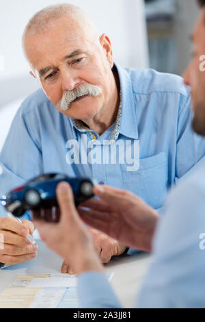 experienced automotive designer looking at car Stock Photo