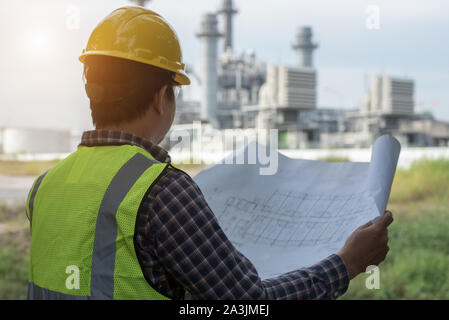 Engineers working in power stations. Stock Photo
