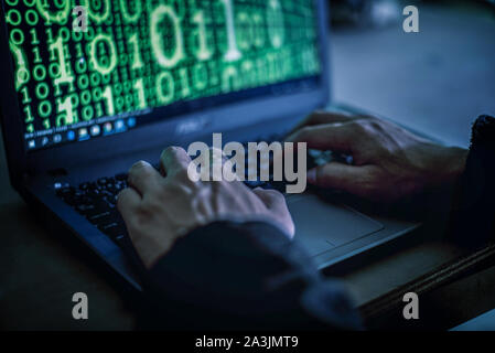 Hacker stealing password and identity, computer crime. Stock Photo