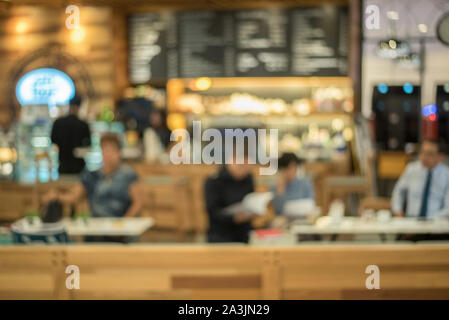 Coffee shop - cafe blurred background with bokeh image / Blur Stock Photo