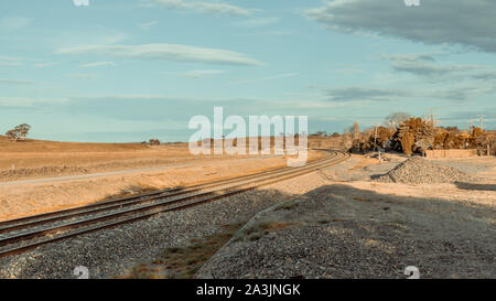 Blue sky with railway coming through Stock Photo