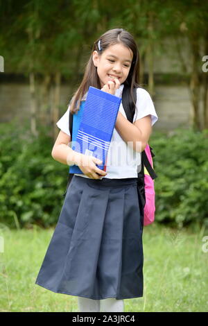 A Shy School Girl With Notebooks Stock Photo