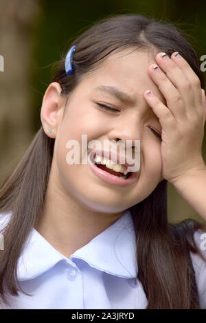 Anxious Diverse Female Student Wearing School Uniform Stock Photo