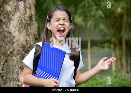 Anxious Female Student School Girl Wearing Uniform With Books Stock Photo