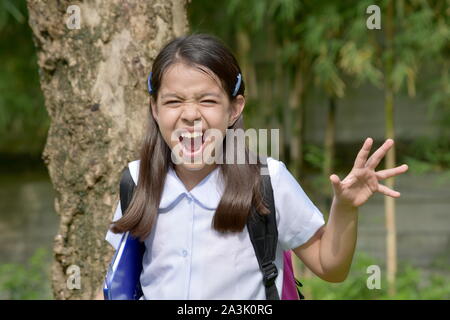 An Angry Diverse Child Girl Student Stock Photo