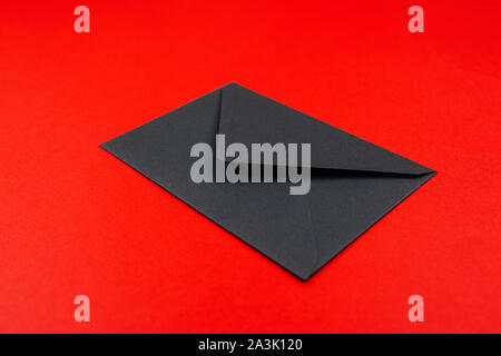 Junk mail or spam and fake letter idea. Concept for unsolicited mail or e-mail. Envelope on red background Stock Photo