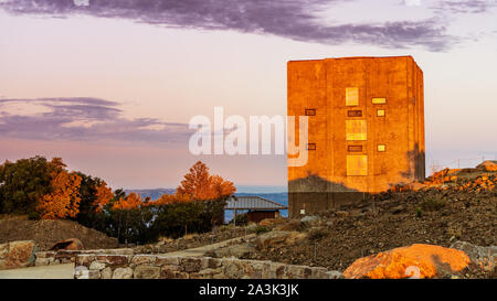 Colorful sunset view of the Radar tower, cold war relic left standing on top of Mount Umunhum, Santa Cruz mountains, South San Francisco Bay Area, Cal Stock Photo