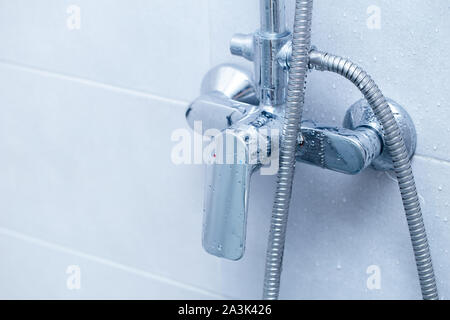 Shower Faucet clean new blue colour tone Stock Photo