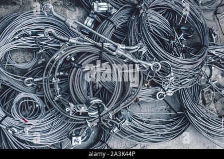 steel wire sling rope metal cable roll with turnbuckles. Stock Photo