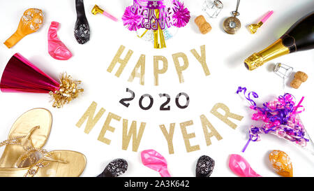 Happy New Year's Eve banner with champagne and pink and gold party decorations. Stock Photo