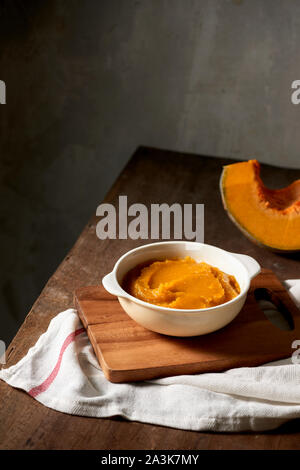 Organic orange pumpkin puree ingredient for baking Stock Photo
