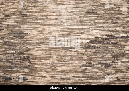 Plywood background. Old paper texture, backdrop. Retro style surface, wooden dirty scratched wall. Vintage rustic pattern of light brown board. Stock Photo