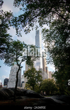 One 57th condominium and office tower as seen from Central Park on Manhattan. The tower is one of an increasing number of expensive luxury condo towers near Central park. Stock Photo