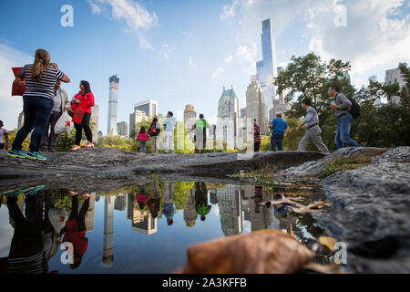 Billionaires' Row. The tall building to the left is 432 Park Avenue condominium and office tower on Manhattan. The tall building to the right is One 57th Street (behind Essex). The towers are two of an increasing number of expensive luxury condo towers near Central park. Stock Photo