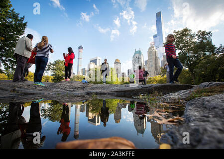 Billionaires' Row. The tall building to the left is 432 Park Avenue condominium and office tower on Manhattan. The tall building to the right is One 57th Street (behind Essex). The towers are two of an increasing number of expensive luxury condo towers near Central park. Stock Photo