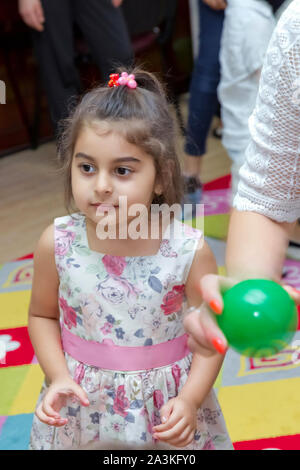 Birthday two years in the kindergarden . Children's birthday with animators . Happy group of children at a birthday celebration dressed in the style Stock Photo