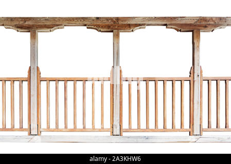 A wooden railing of a balcony with wooden columns isolated on white background Stock Photo