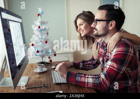 Young couple of designers working on computer Stock Photo
