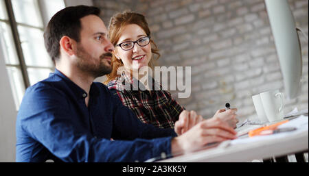 Portrait of young designers working on computer Stock Photo