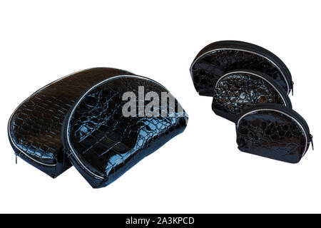 Black leather cosmetic bags isolated on white. Set of make up containers. Stock Photo