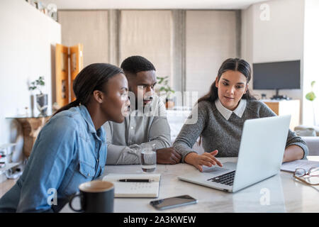 African American couple listening to their financial planner at home Stock Photo
