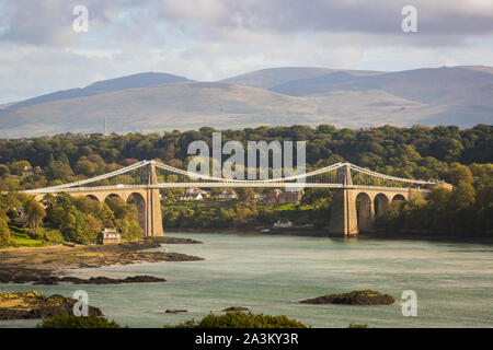 The Menai suspension bridge designed by Thomas Telford and completed in 1826 to connect the mainland with the island of Anglesey Wales Stock Photo