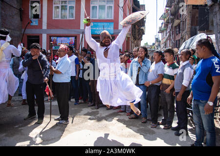 Bhaktapur, Nepal. 09th Oct, 2019. A man attired as a warrior jumps in air with an ancient sword during a traditional ritual dance on Khadga Jatra in Thimi, Nepal on October 9, 2019. (Photo by Rojan Shrestha/Pacific Press) Credit: Pacific Press Agency/Alamy Live News Stock Photo