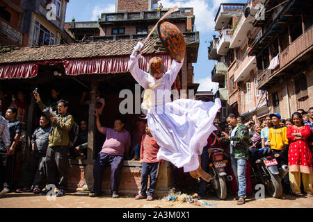 Bhaktapur, Nepal. 09th Oct, 2019. A man attired as a warrior jumps in air during a traditional ritual dance on Khadga Jatra in Thimi, Nepal on October 9, 2019. (Photo by Rojan Shrestha/Pacific Press) Credit: Pacific Press Agency/Alamy Live News Stock Photo