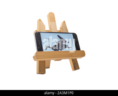 A smartphone on a small painting easel Stock Photo
