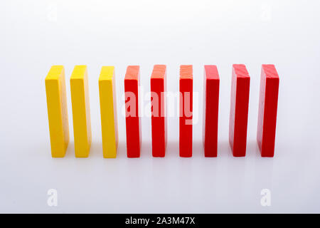 Colorful Domino Blocks placed on a white background Stock Photo