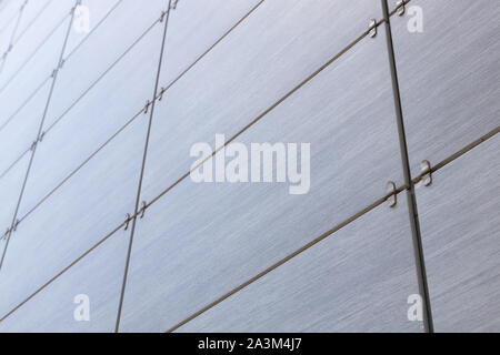 Diagonal view of gray concrete abstract smooth texture on tile of wall or other surface. Gradient on top. Stock Photo