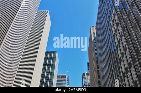 Tall skyscrapers on 6th Avenue in  New York, including the offices of UBS Financial Services. Stock Photo