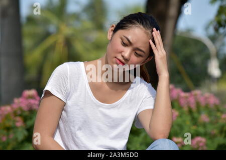 Worrisome Youthful Asian Person Stock Photo