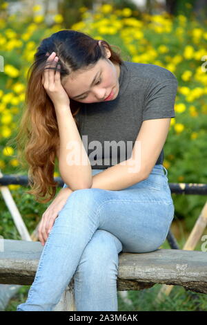 Worried Youthful Asian Person Stock Photo